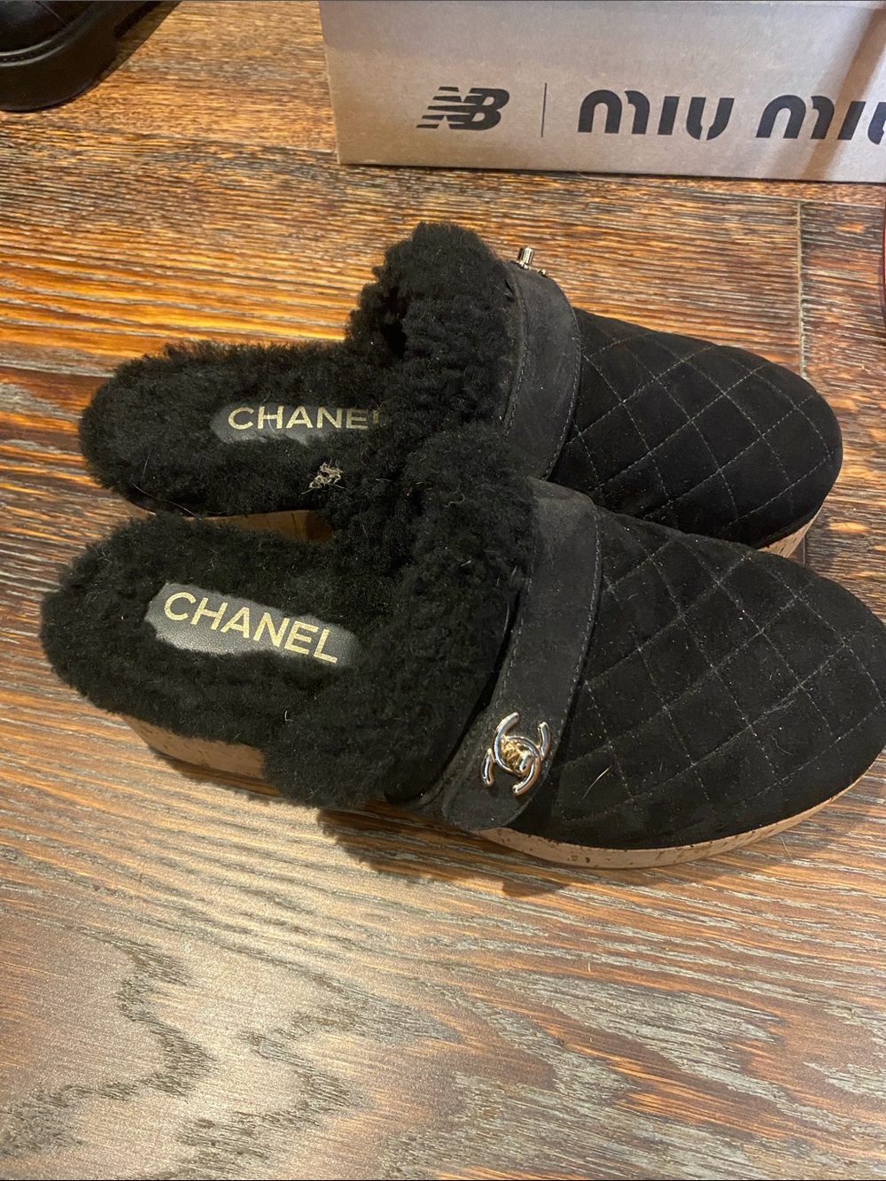 CHANEL Black Quilted Shearling Slip-On Mules with Gold CC Accent